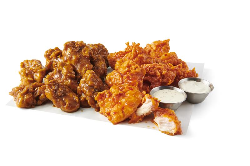 “Golden brown crispy chicken tenders with crunchy coating, freshly served at Atomic Wings Houston.”