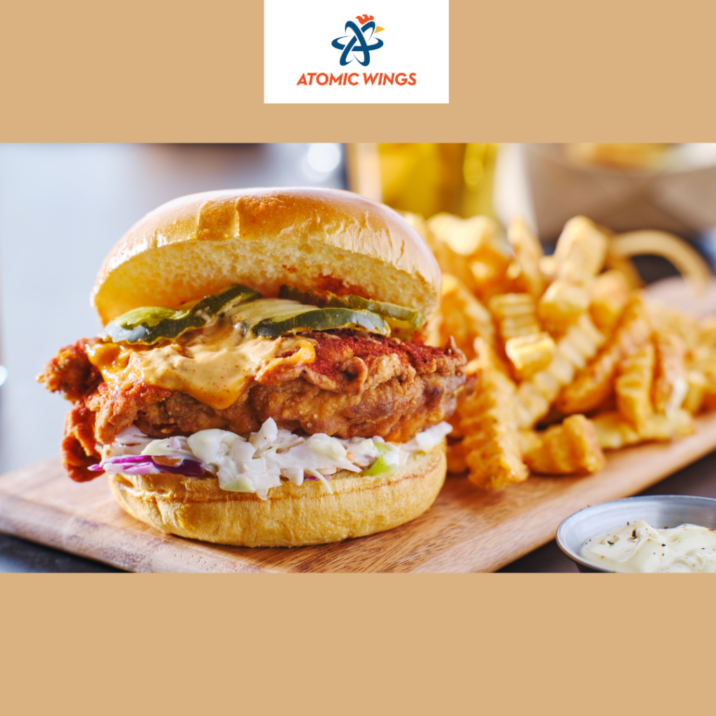 Crispy classic chicken sandwich served with fresh lettuce, pickles, and Atomic sauce on a toasted bun at Atomic Wings Houston.